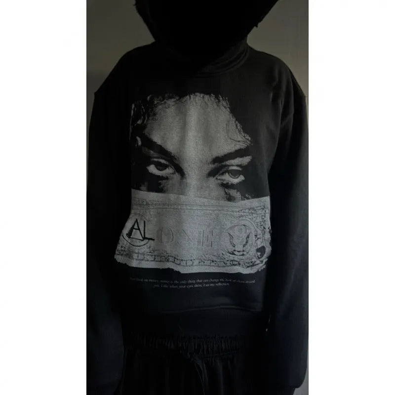 Women's loose fit black polyester hoodie with dark printed cartoon pattern front view