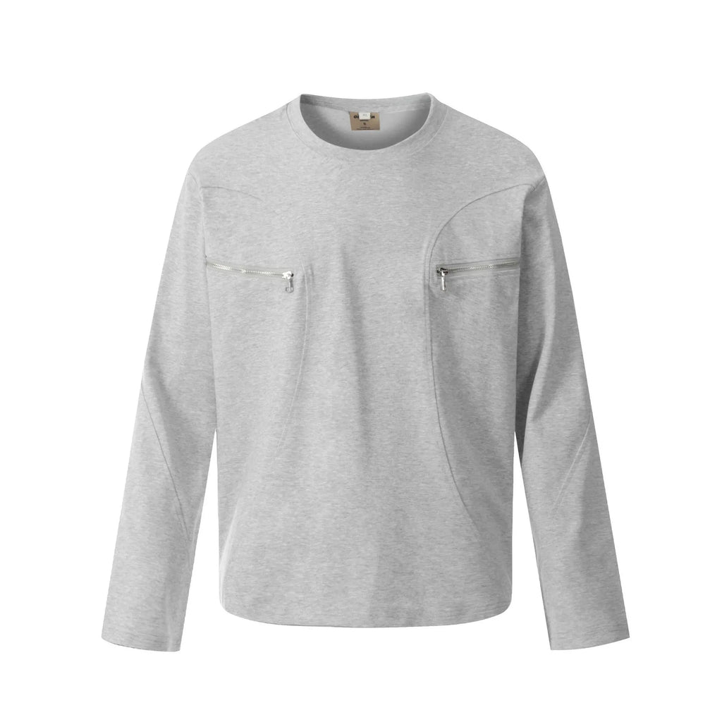 Man wearing a loose black cotton pullover top with long sleeves in a casual setting.