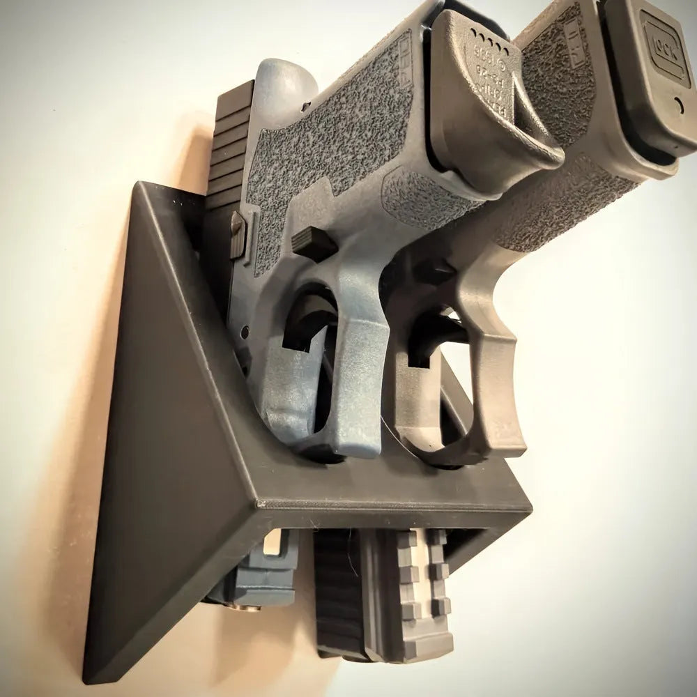 Black punk-style plastic pistol stand for toy gun display.