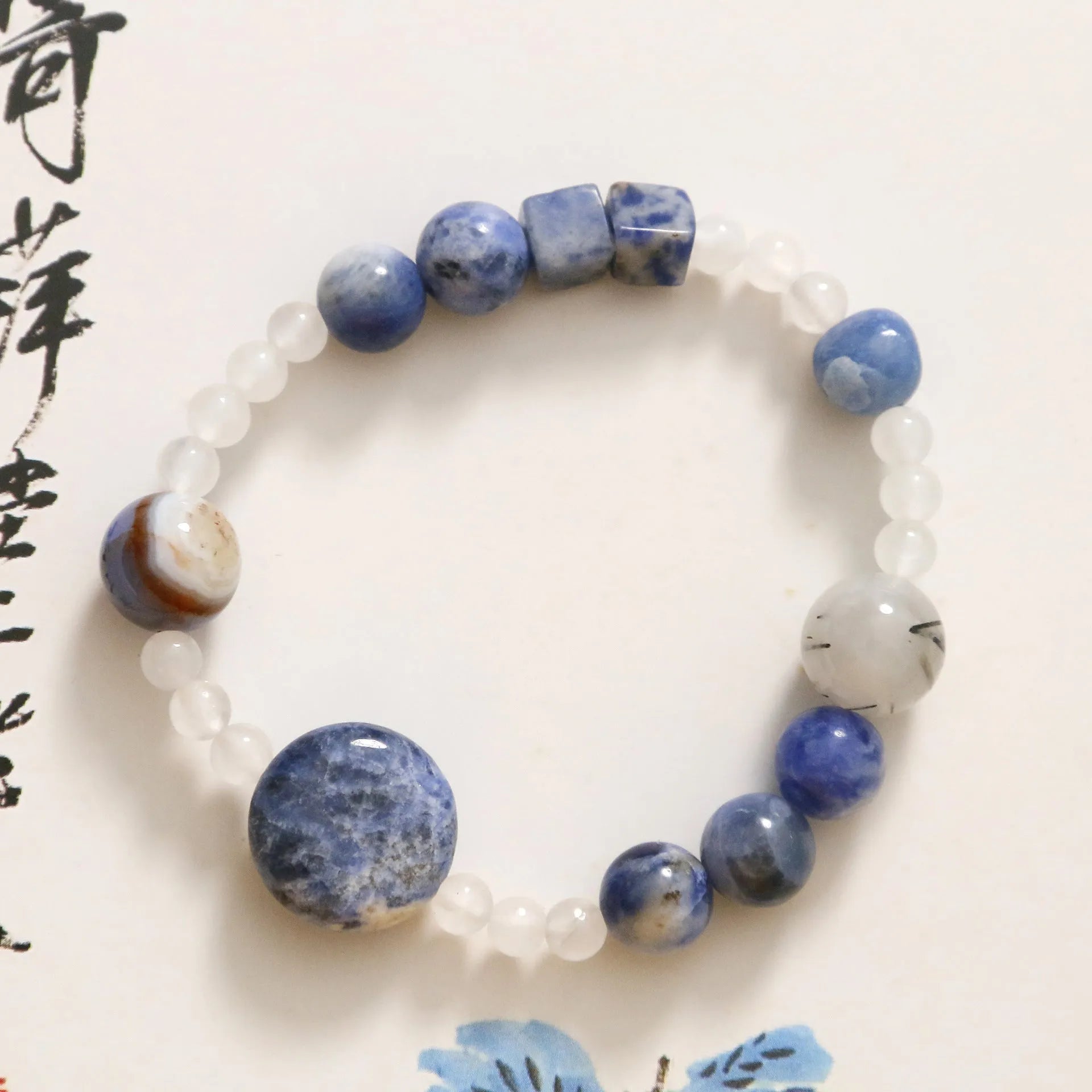 Natural blue point stone and black hair crystal agate hand-woven unisex bracelet with round and oval geometric beads