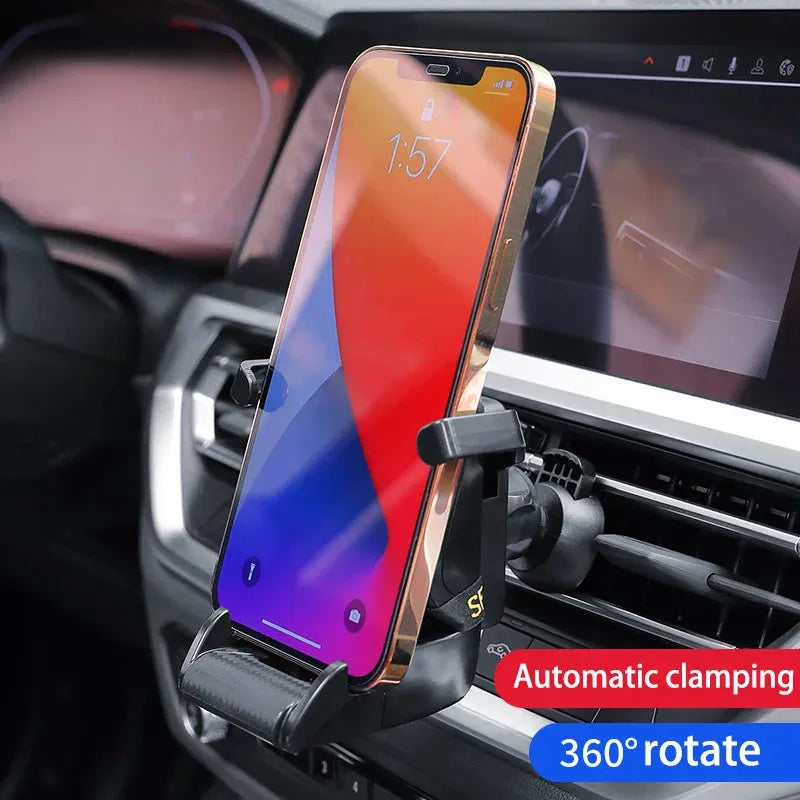 Racing seat shape car phone holder clipped to a car air vent with a gold tape colour finish