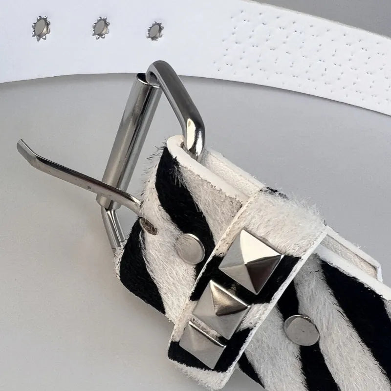 Women's punk fashion belt with metal rivets and pyramid studs in leopard print pattern