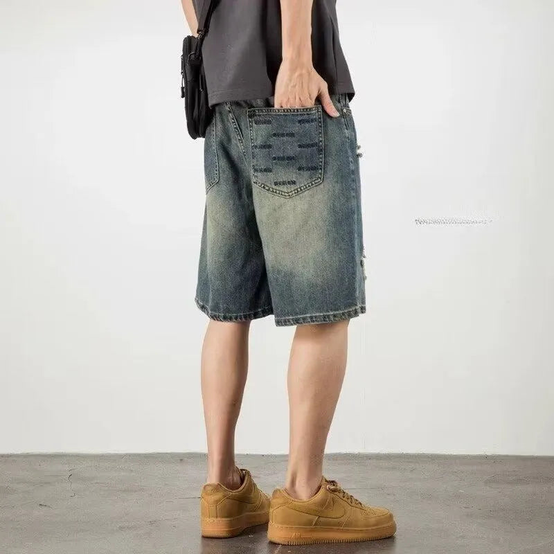Men's blue denim shorts with loose hole retro styling and straight cut design