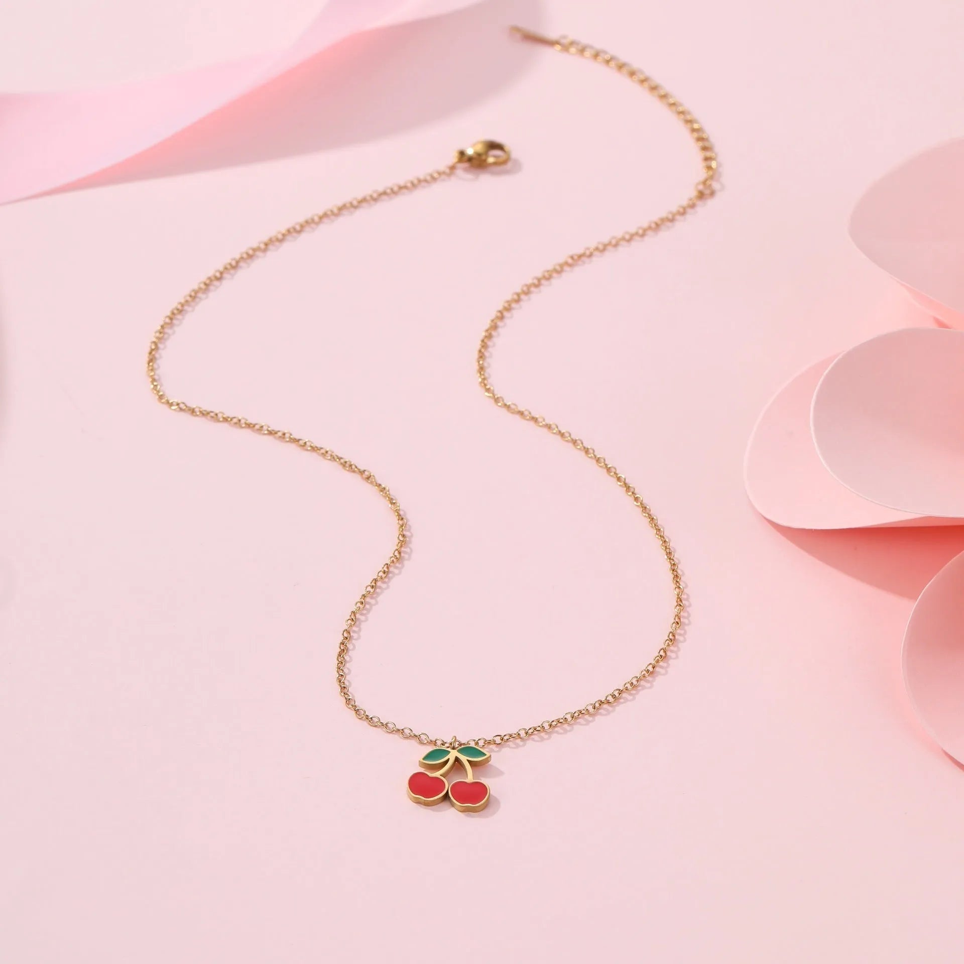 Complete cherry jewellery set with stainless steel necklace, bracelet, earrings, and ring featuring 18K electroplating