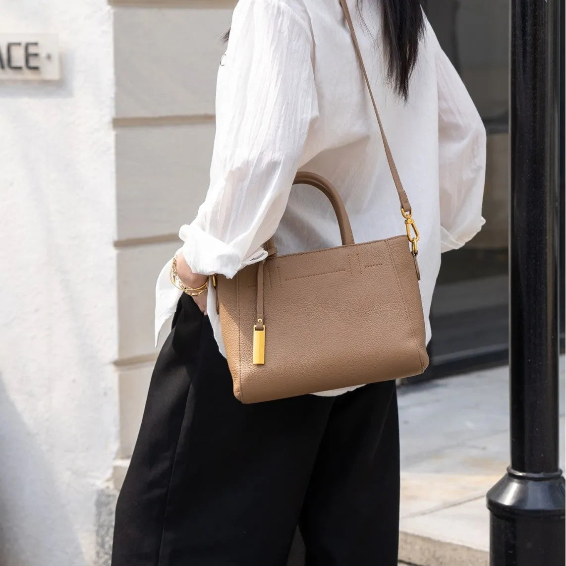 Portable genuine leather women handbag in soft cowhide with horizontal square shape and single strap, available in multiple colours