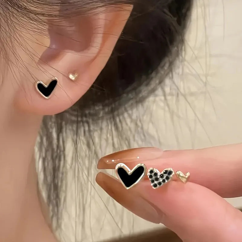Three pairs of women's heart-shaped alloy earrings in coordinated set with electroplated finish
