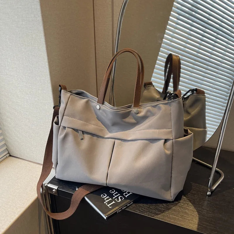 Nylon crossbody tote bag in milky white with short shoulder strap and flat base