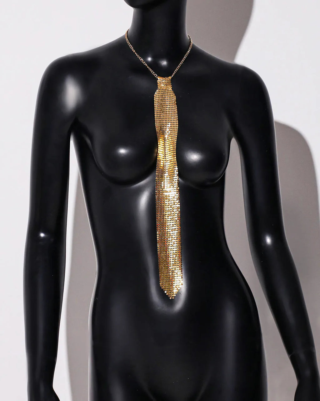 Metal sequins bow tie in arrow shape with electroplated finish in silver, gold, and black