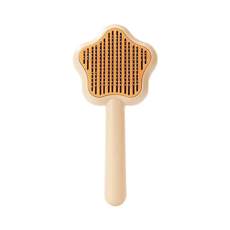 Green self-cleaning stainless steel pet comb for grooming cats and dogs on a white background
