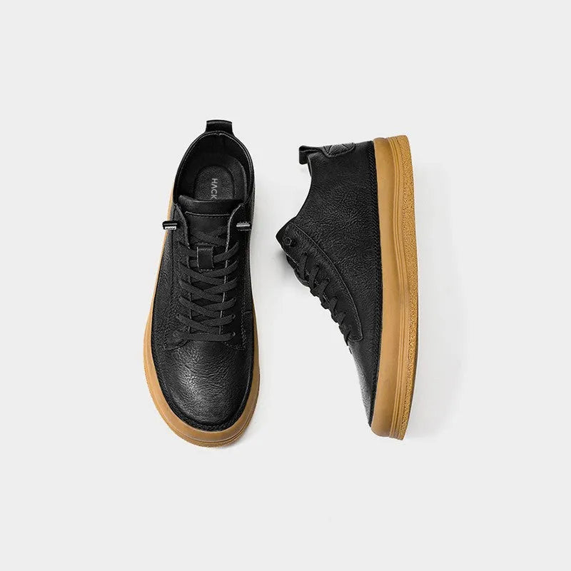 Men's black leather lace-up casual shoes with a round toe and flat rubber sole on a white background.