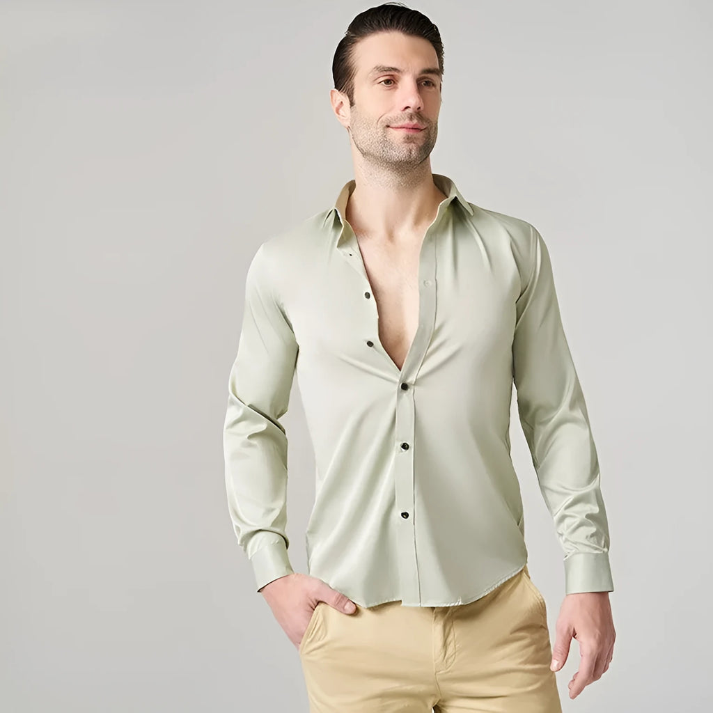Men's blue stretch long sleeve work shirt made from polyester fabric on a hanger.