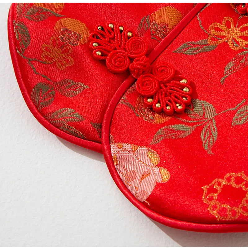 Red cheongsam pet vest with decorative knot buttons, floral and fruit patterns, for Lunar New Year