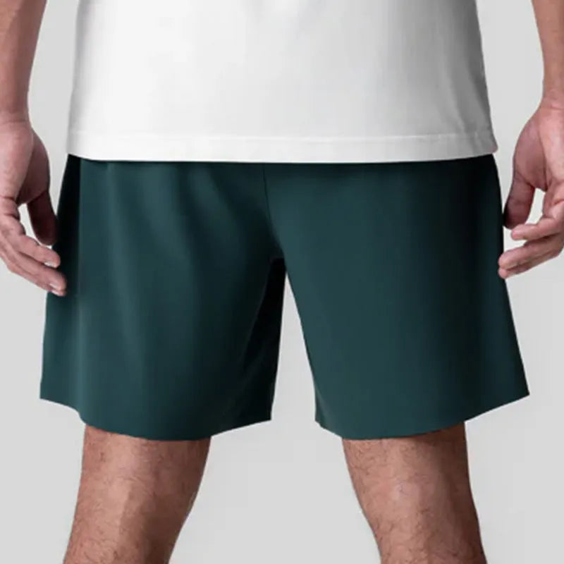 Men's seamless quick-drying sports shorts in black with multi-bag design, shown straight-leg cut