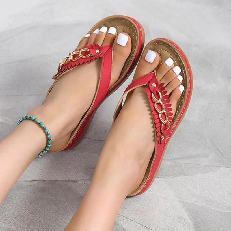 Women's anti-slip wedge sandals with chain detail in black, dark brown, and red on a light background