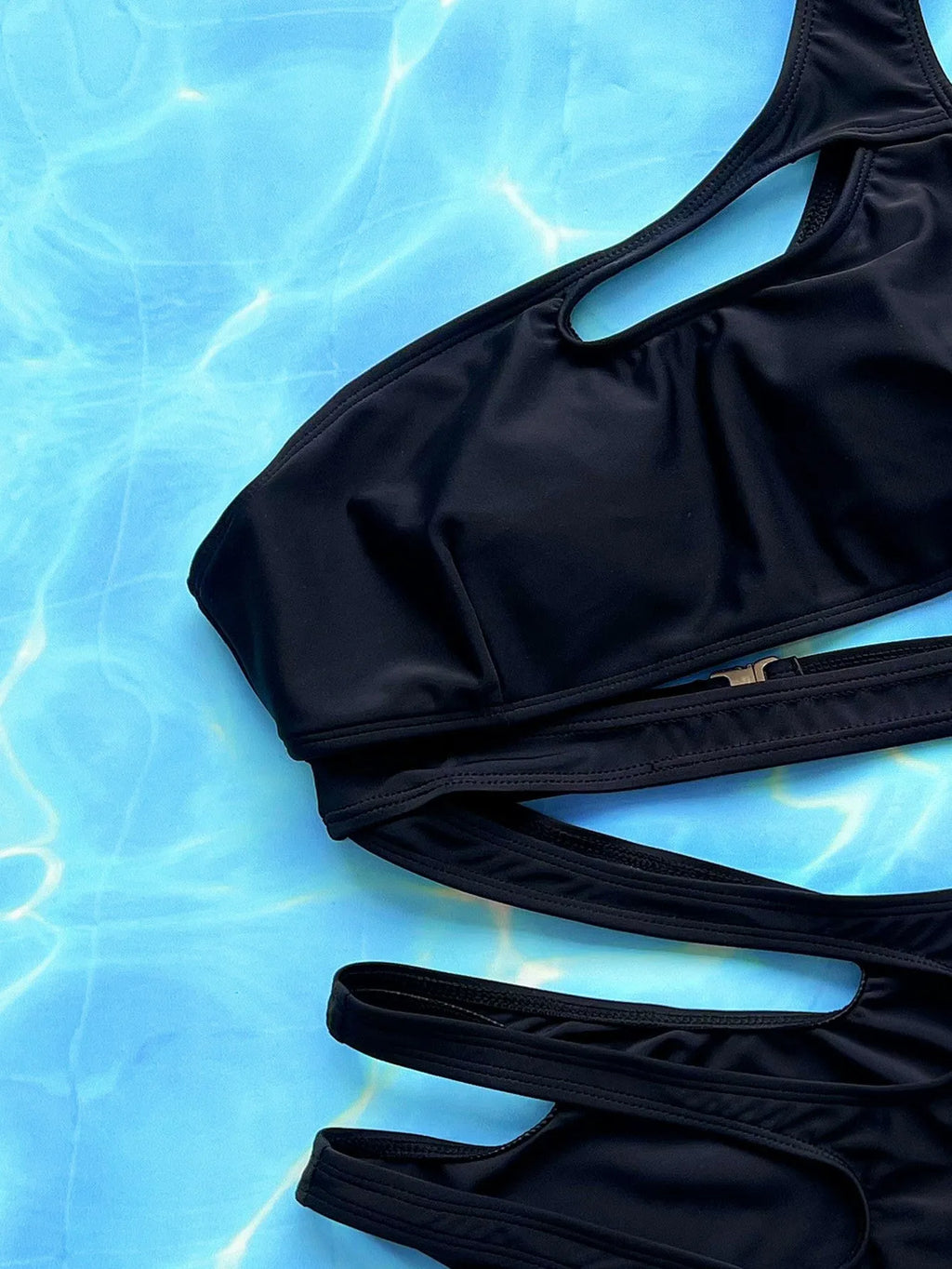 Women's black solid colour one-piece nylon swimsuit with hollow-out strap detail