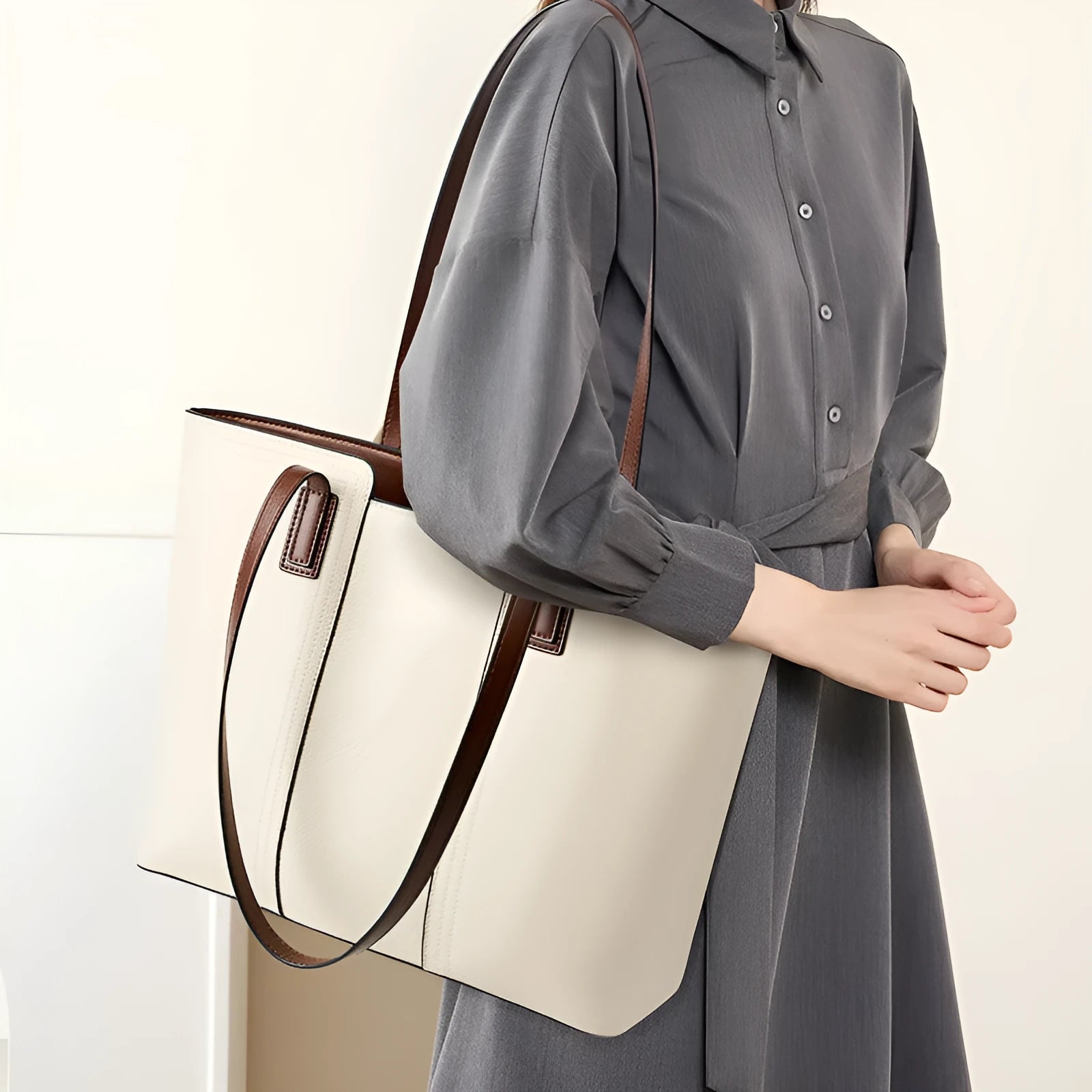 Women's black genuine leather crossbody commuter bag with horizontal square design showing internal organisation compartments