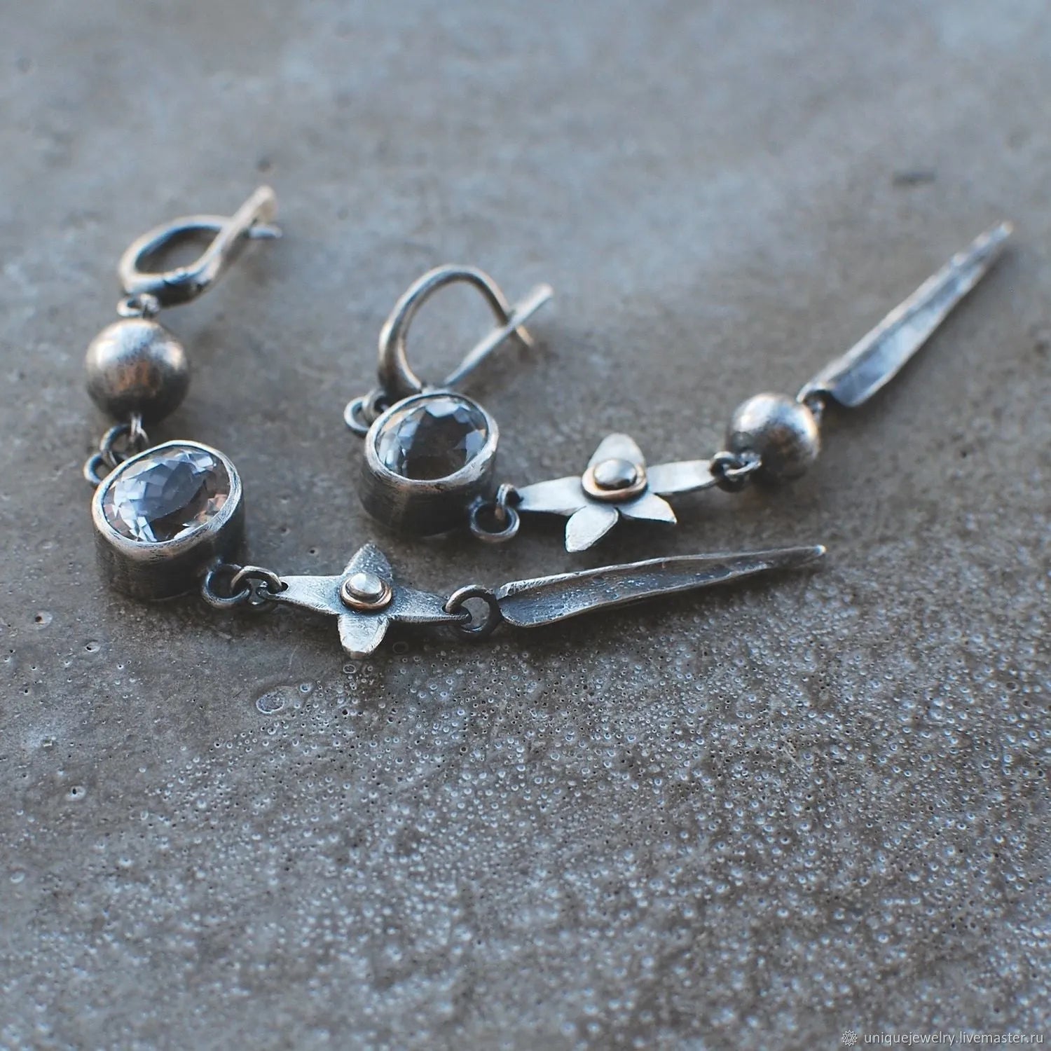 Geometric XINGX pendant earrings with antique silver plating and rhinestone details