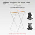 Outdoor folding garbage storage hanger with wrought iron frame and wooden handle.