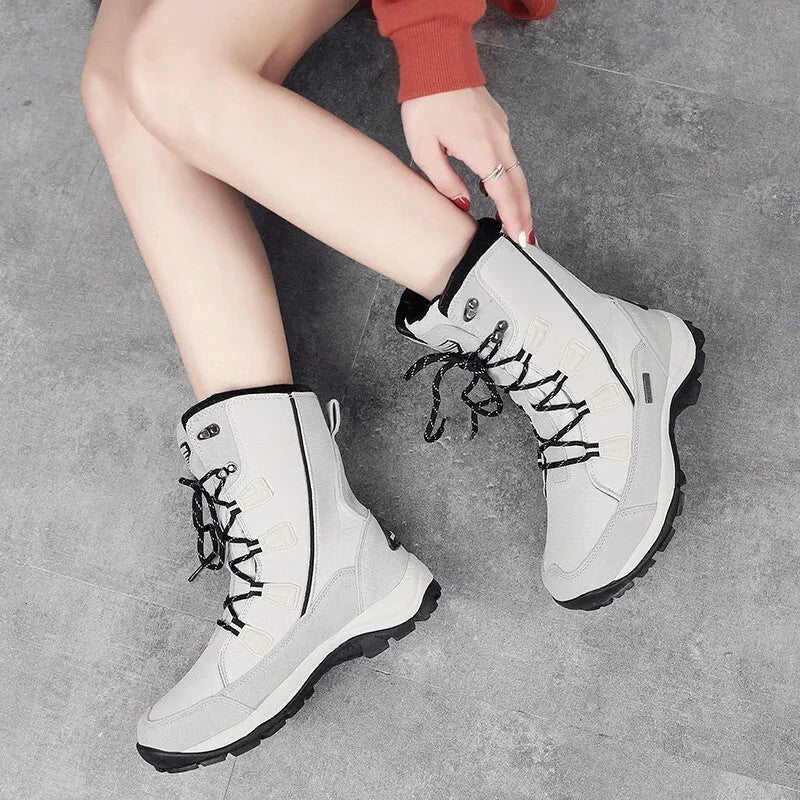 Women's genuine leather snow boots in mid-calf length with round toe and rubber sole