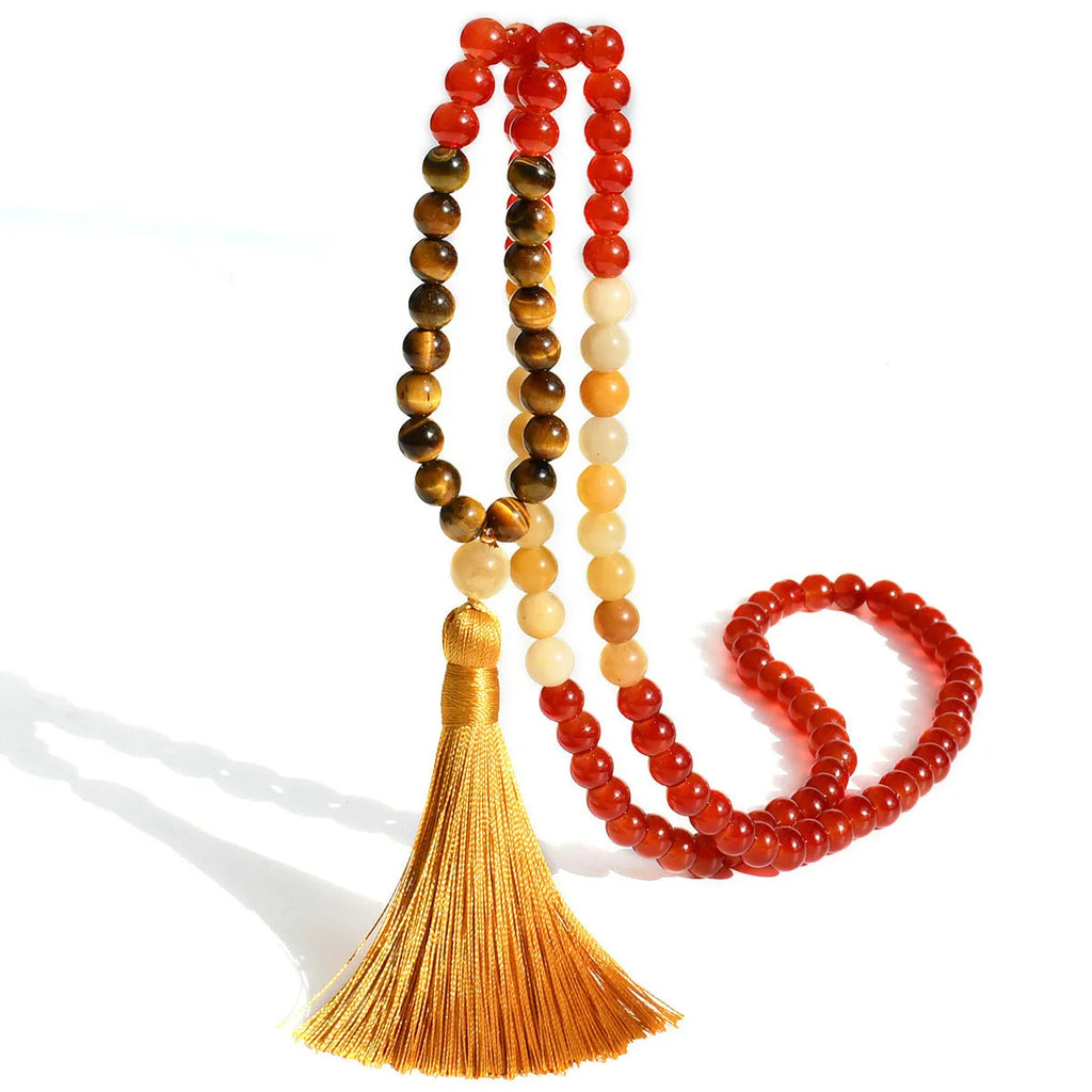 Handmade Bohemian long necklace with natural stone tassel and geometric mixed gem pendant.