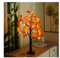 LED white birch tree night light with 24 lights, 60cm height, black birch finish, on a tabletop