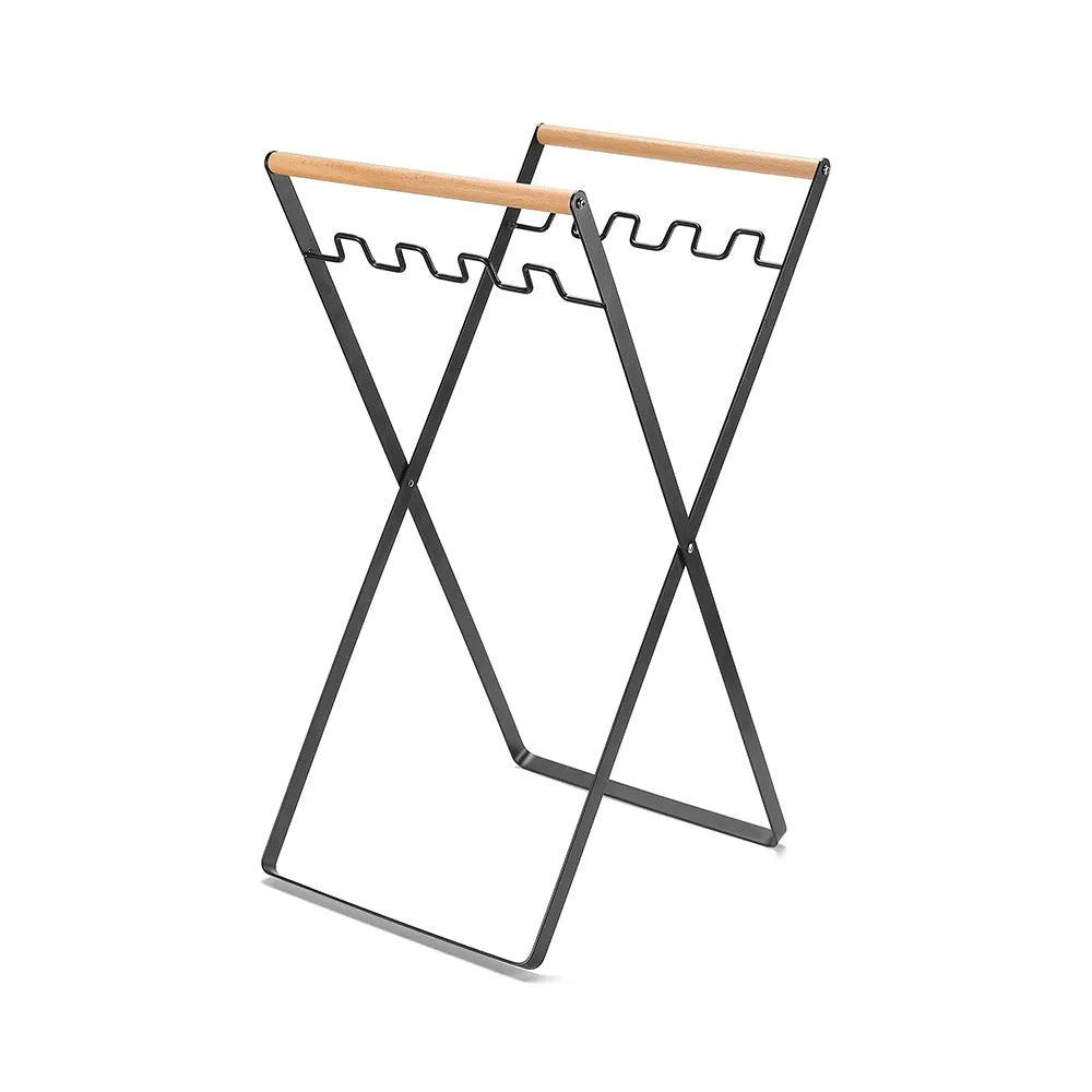 Outdoor folding garbage storage hanger with wrought iron frame and wooden handle.