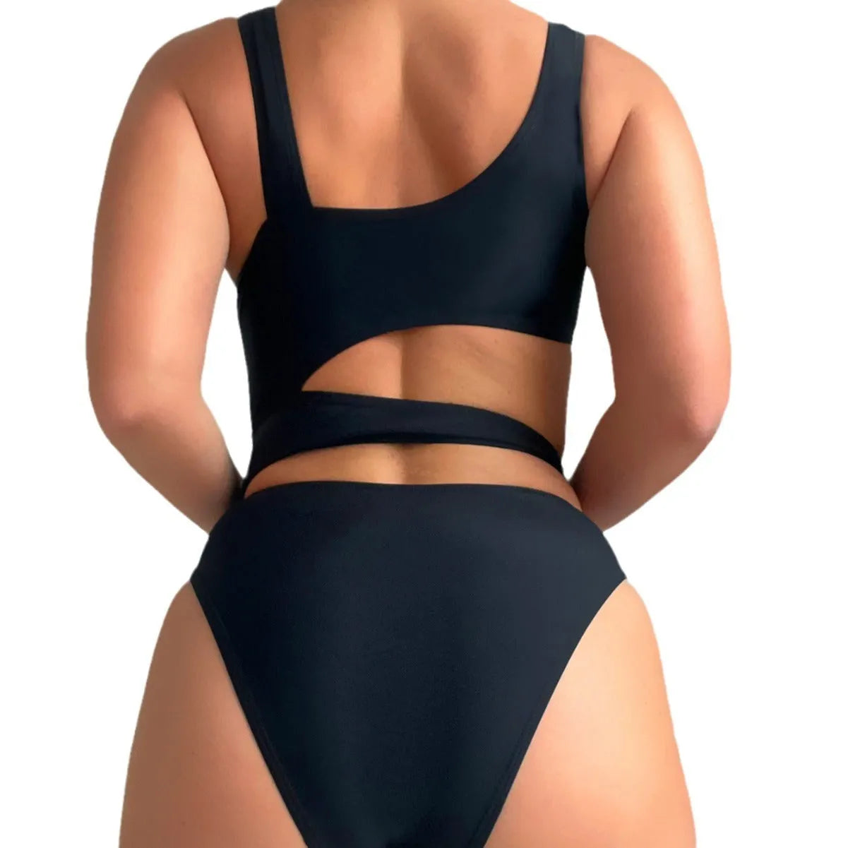 Women's solid black one-piece swimsuit with hollow cut-out design and high-cut leg on display