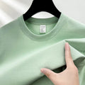 Men's drop shoulder solid colour cotton T-shirt in white, front view, short sleeves, relaxed fit