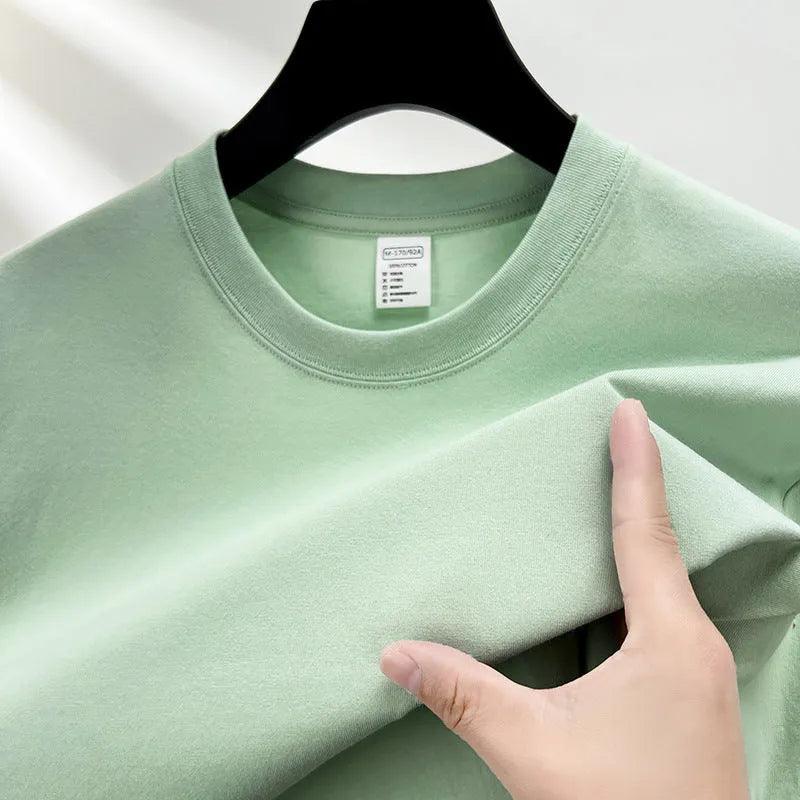 Men's drop shoulder solid colour cotton T-shirt in white, front view, short sleeves, relaxed fit