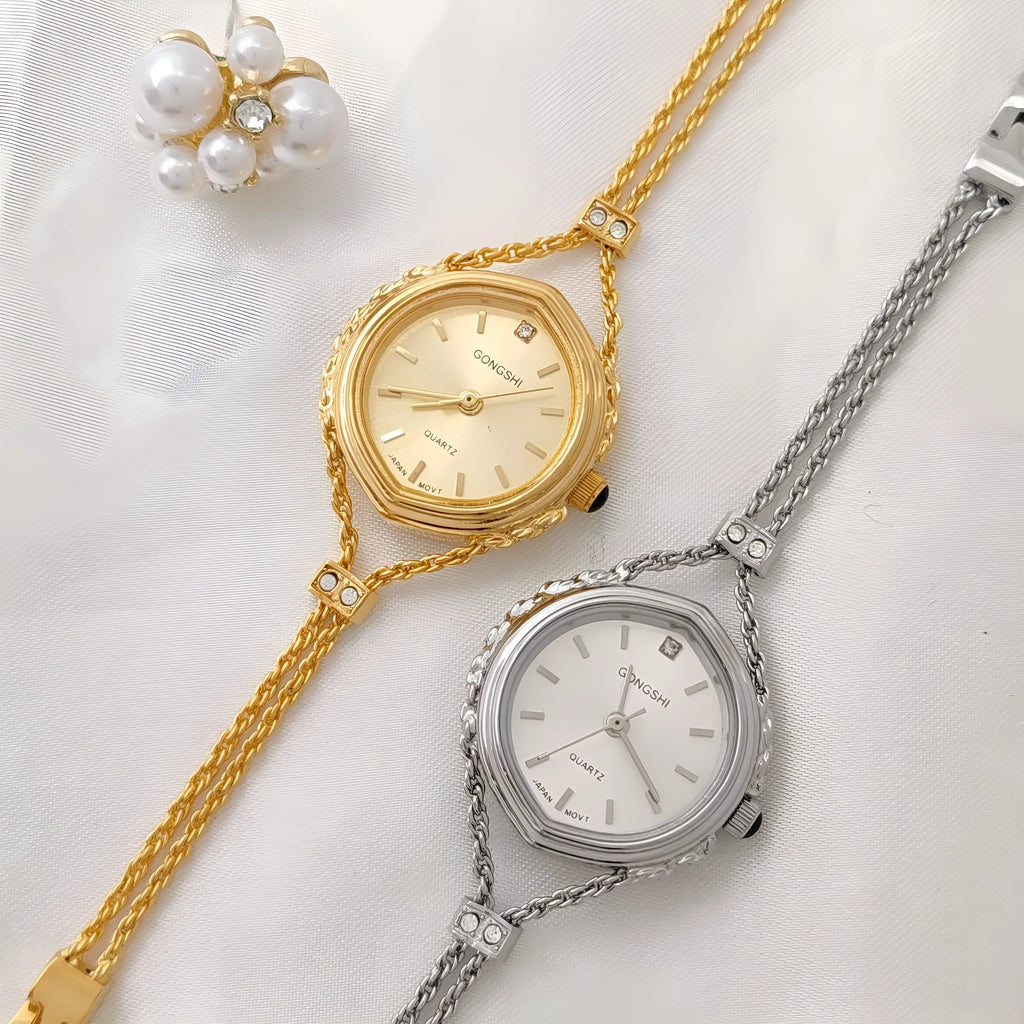 Women's quartz watch with gold copper plating, 25mm dial, mineral glass mirror, and metal chain strap on white background