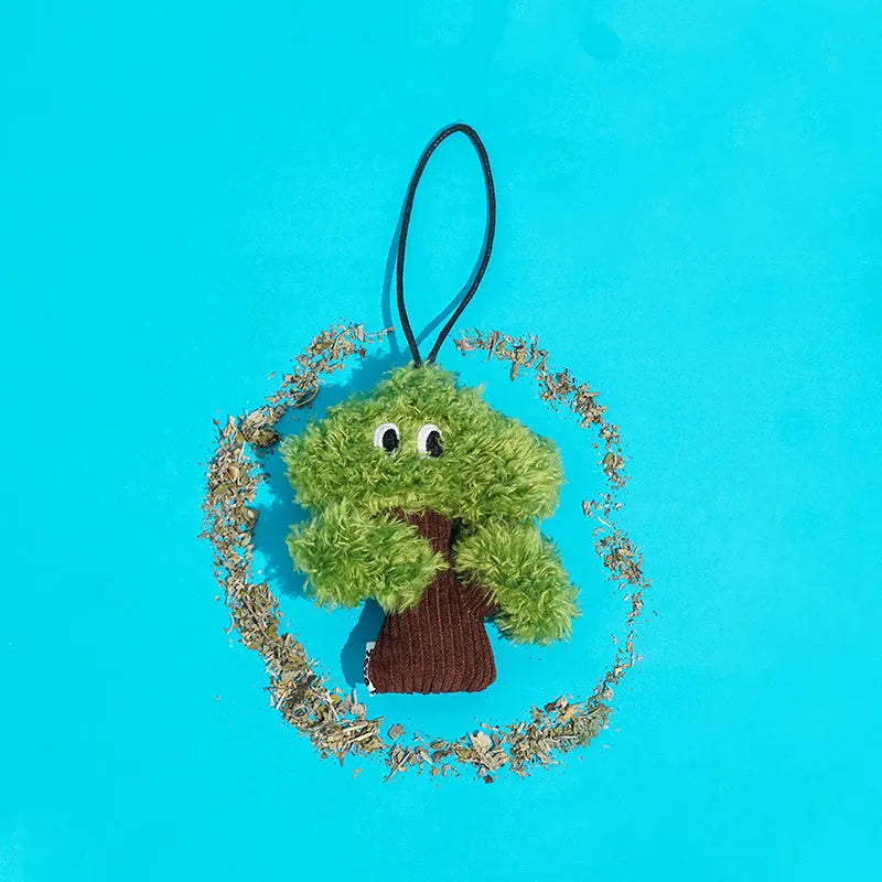 Pine tree shaped fabric cat toy with mint stick inside, measuring 10cm long