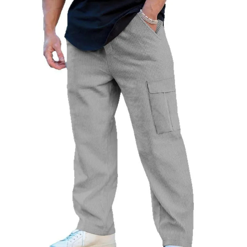Men's loose-fitting corduroy cargo trousers in navy blue with a drawstring waist and wide straight legs