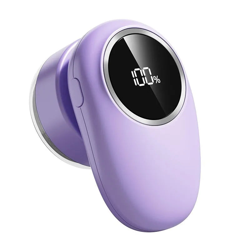 Purple and beige digital display fur ball trimmer with removable cutter heads on a fabric background