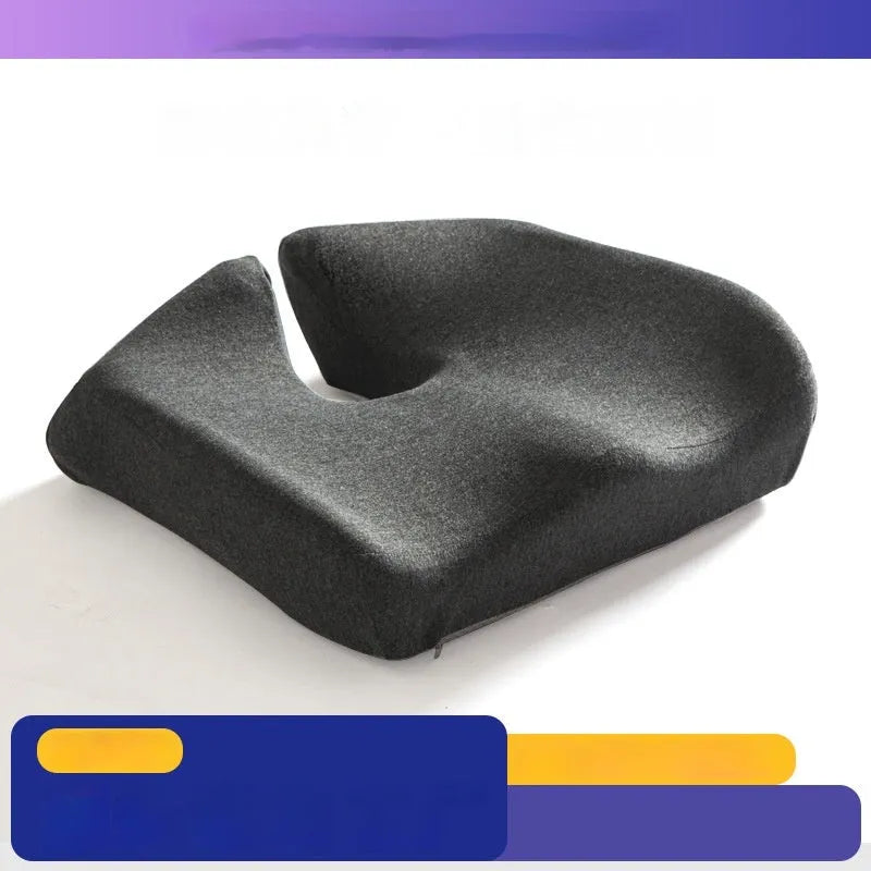 Memory foam office chair cushion in a solid colour, shown on a desk chair for scale.