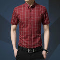 Men's red plaid short sleeve slim fit shirt with cotton blend fabric on a hanger