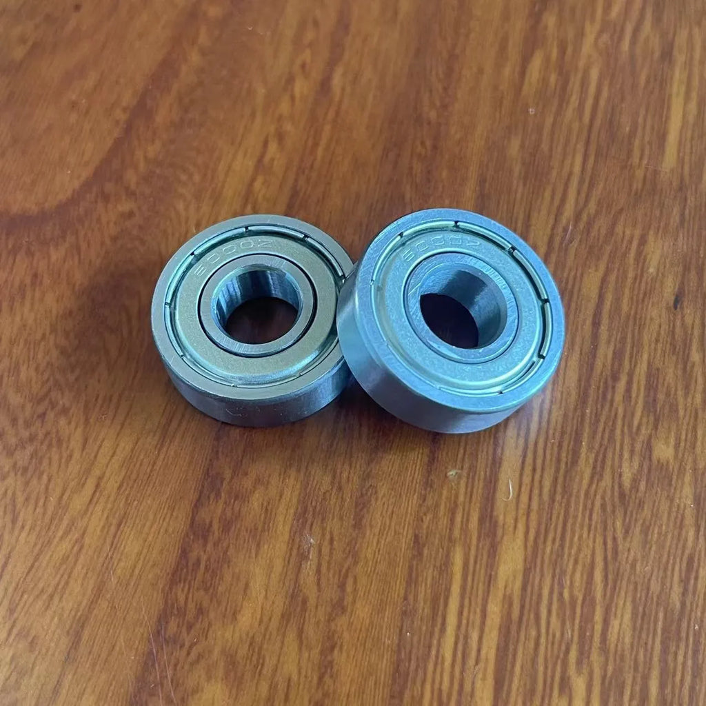 Carbon steel bearing 6000zz 10x26x8mm with iron retainer on white background