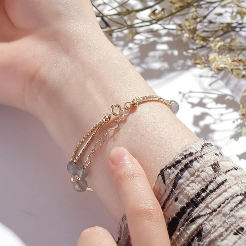 Crystal bracelet with double-layer copper tube and moonstone finish on white background
