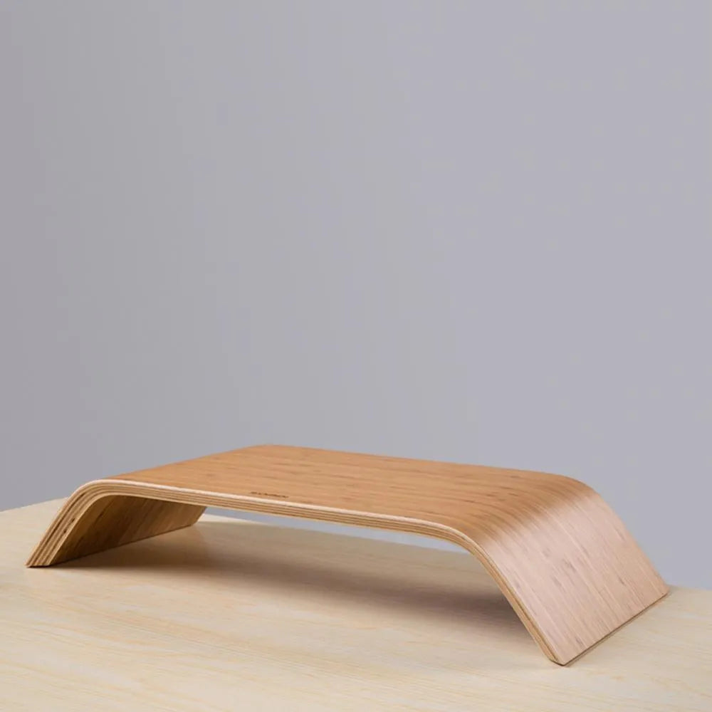 Walnut wood laptop stand with bamboo leather colour finish, 23x51x9cm dimensions, on a desk