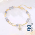 Natural gray moonstone Mobius crystal bracelet with polished finish on women's wrist
