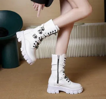 Women's black mid-calf boots with metal buckle strap and side zip on a white background.