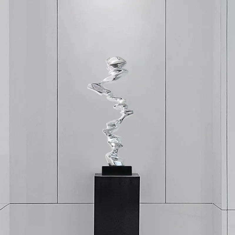 Modern abstract still life sculpture ornament in bright gold, elegant silver, or phantom blue.