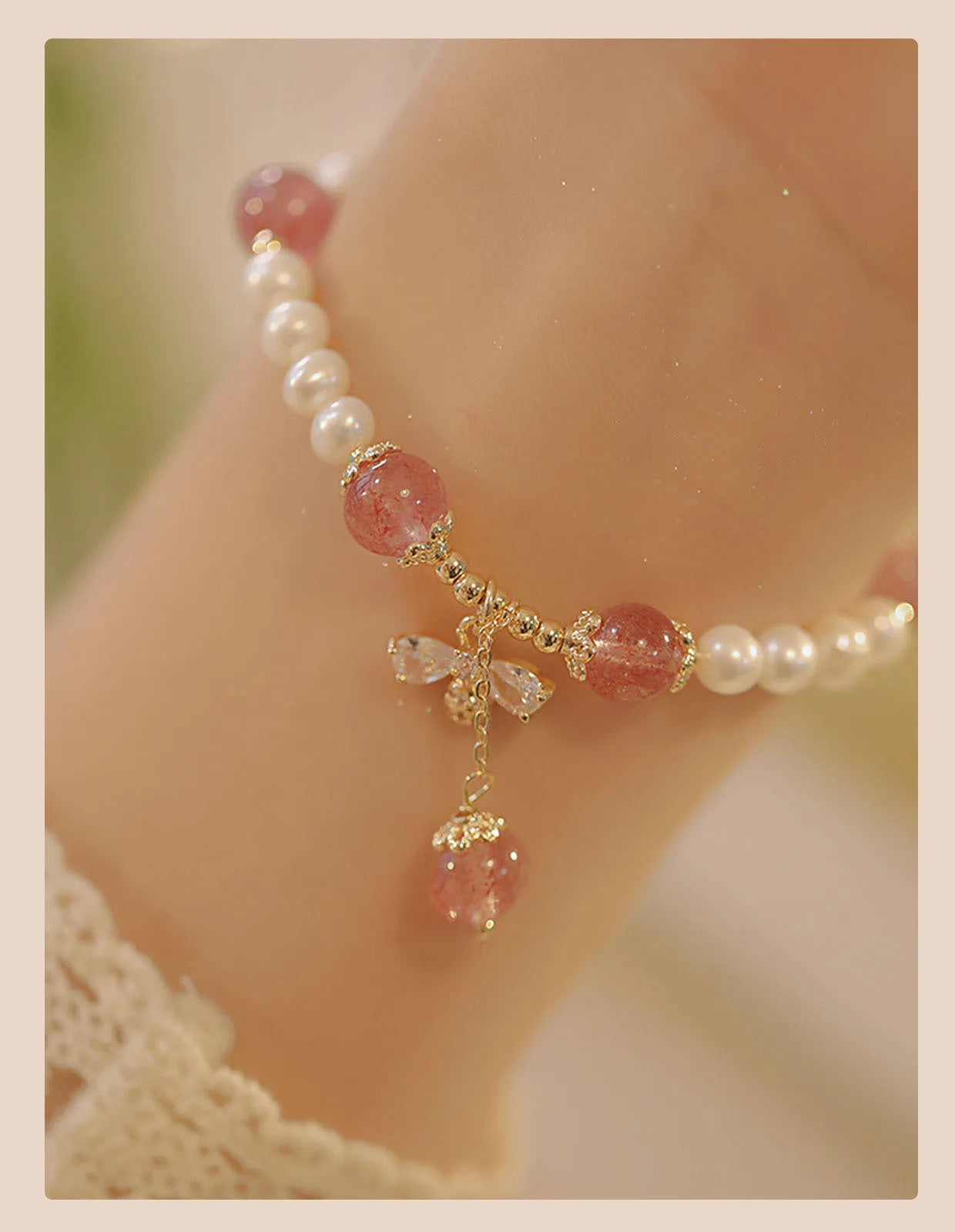 Crystal strawberry quartz bracelet with bow detail on white background, women's INS-style accessory