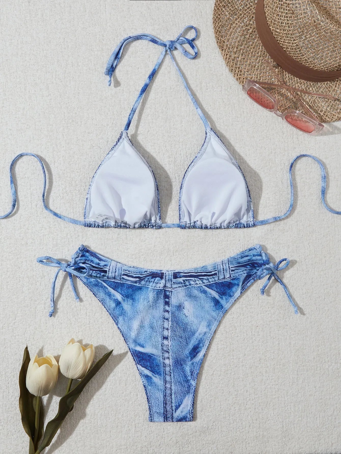 Women's denim blue printed bikini set with strap design, shown as a two-piece swimsuit.