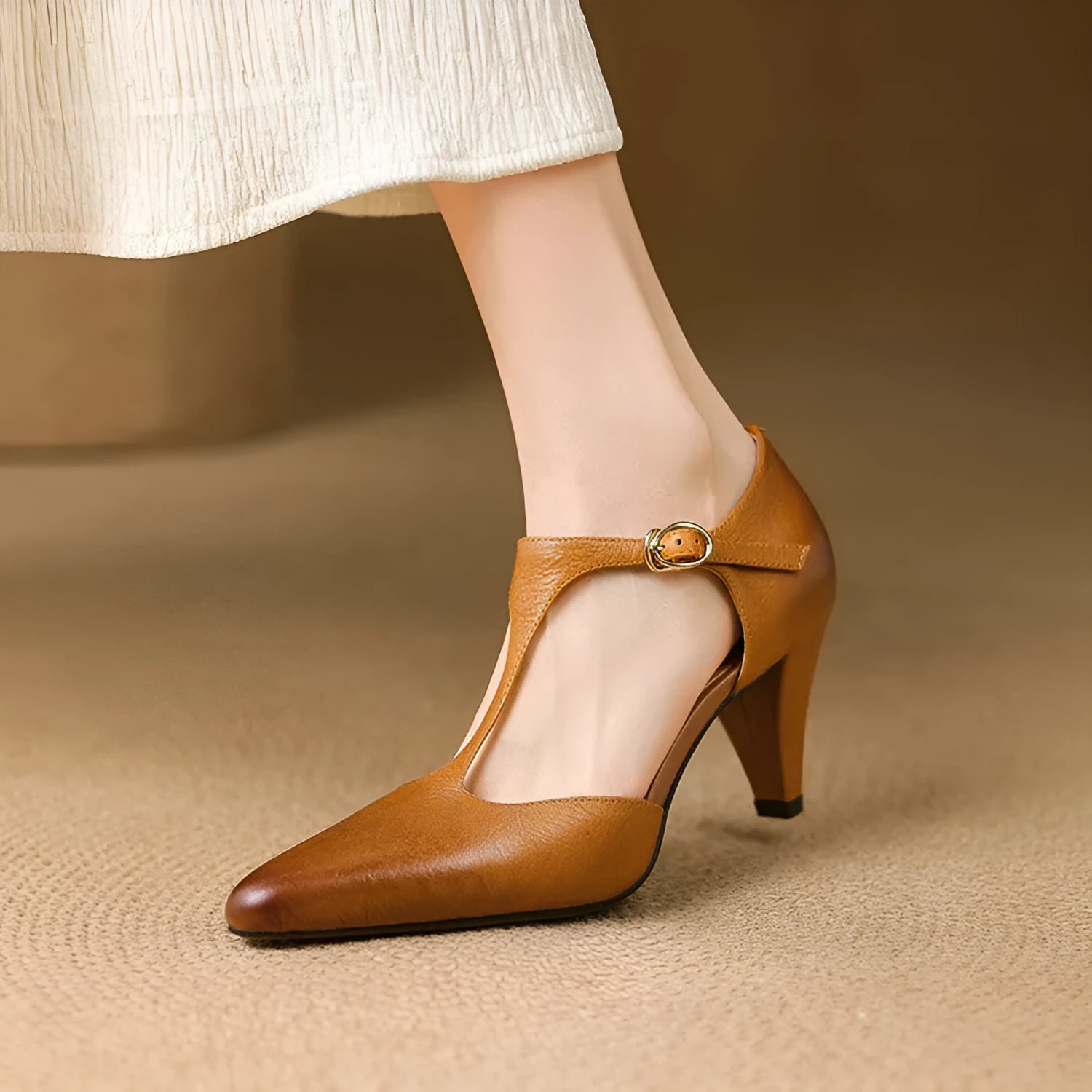 Brown retro women's T-strap sandals with a buckle, closed toe, and a short stout heel.