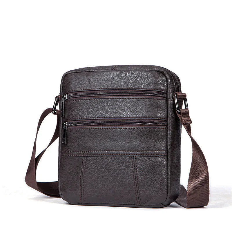Vintage brown genuine leather shoulder bag for men showing front zipper and structured square shape.