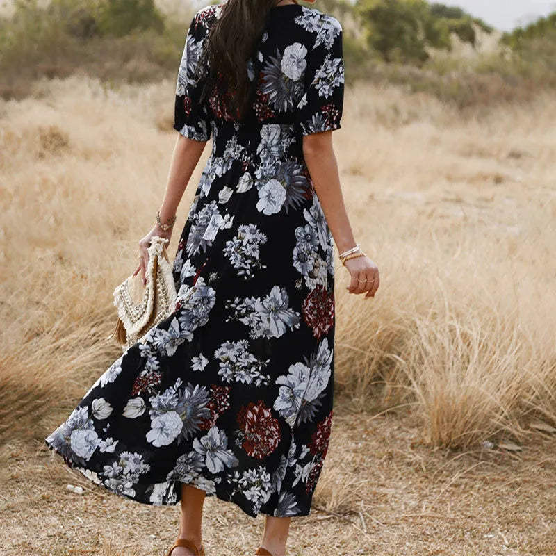 Yellow floral summer dress with V neck and elastic waist on mannequin