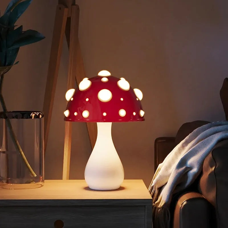 Mushroom decorative table lamp with white base and tricolour light on a wooden nightstand