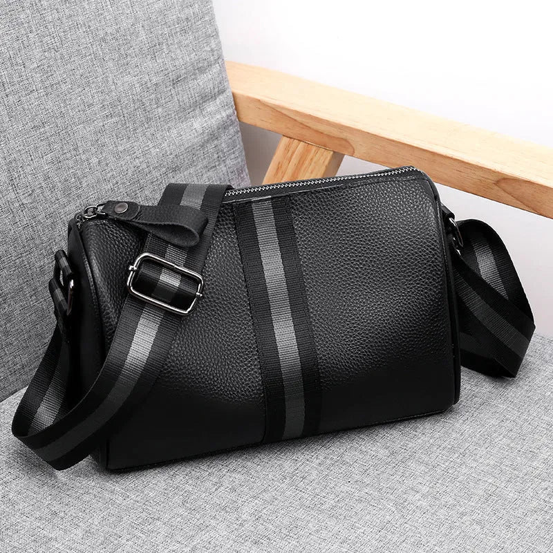 Black genuine leather one-shoulder crossbody bag with large capacity.