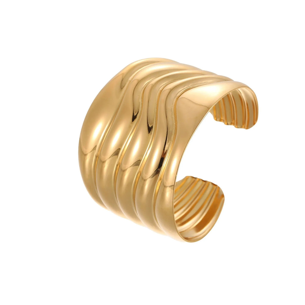 Women's geometric wave bracelet in stainless steel with gold plating and asymmetric design