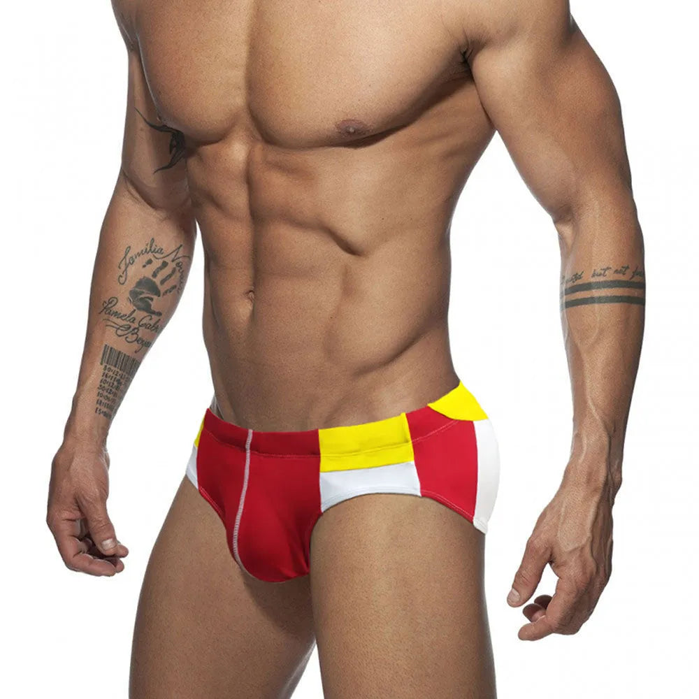 Men's nylon swim briefs with bright line colour matching and hip drainage line, available in red and dark blue